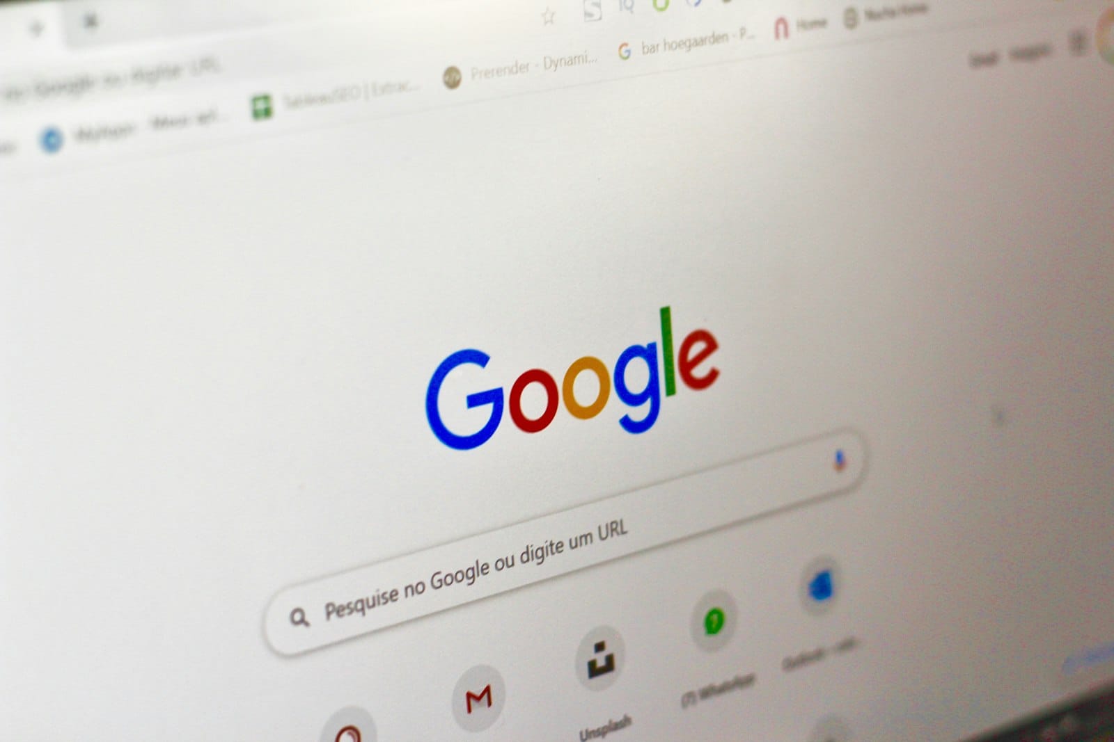 A laptop screen showing a Google search bar in a browser