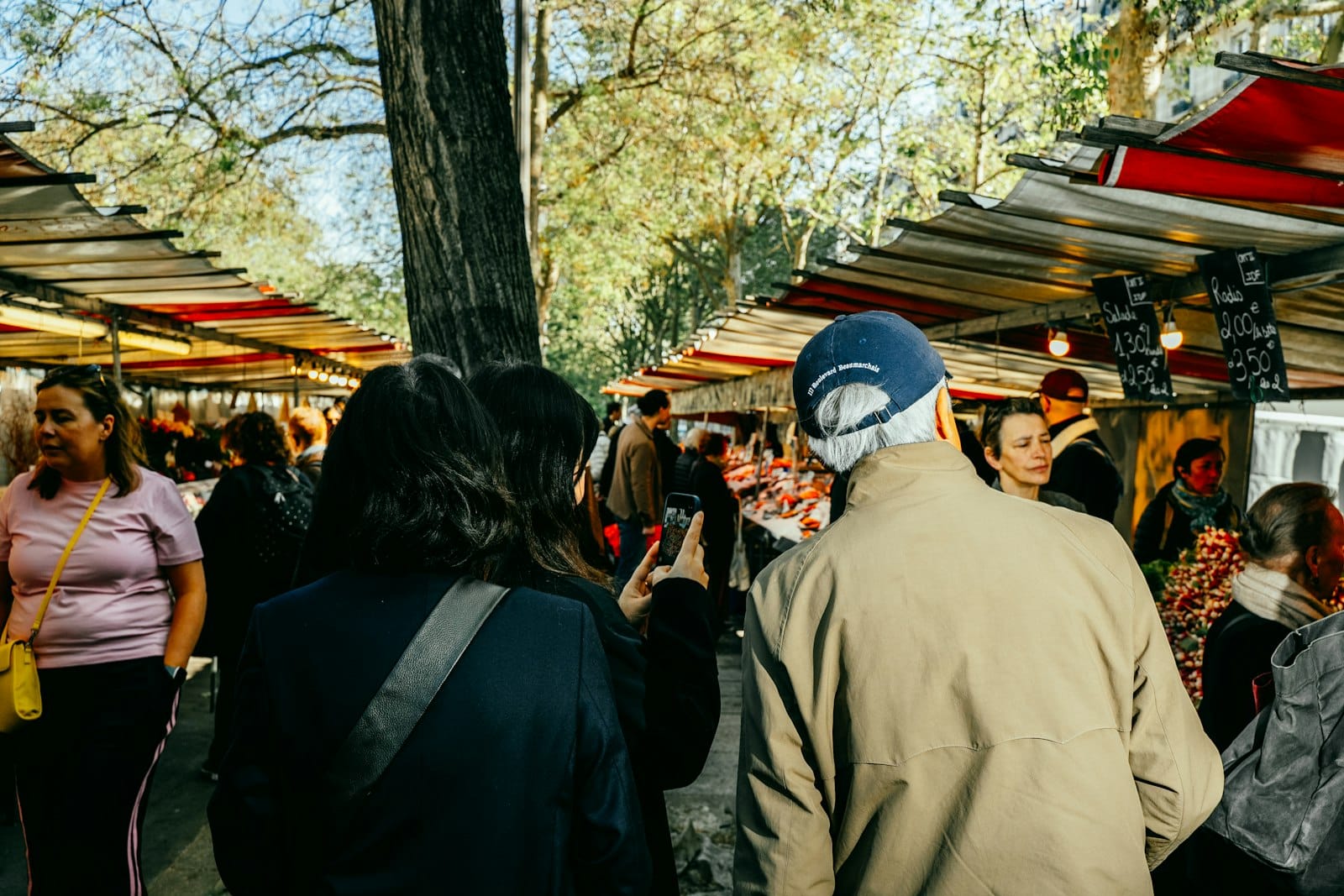 People browsing stalls at an outdoor market