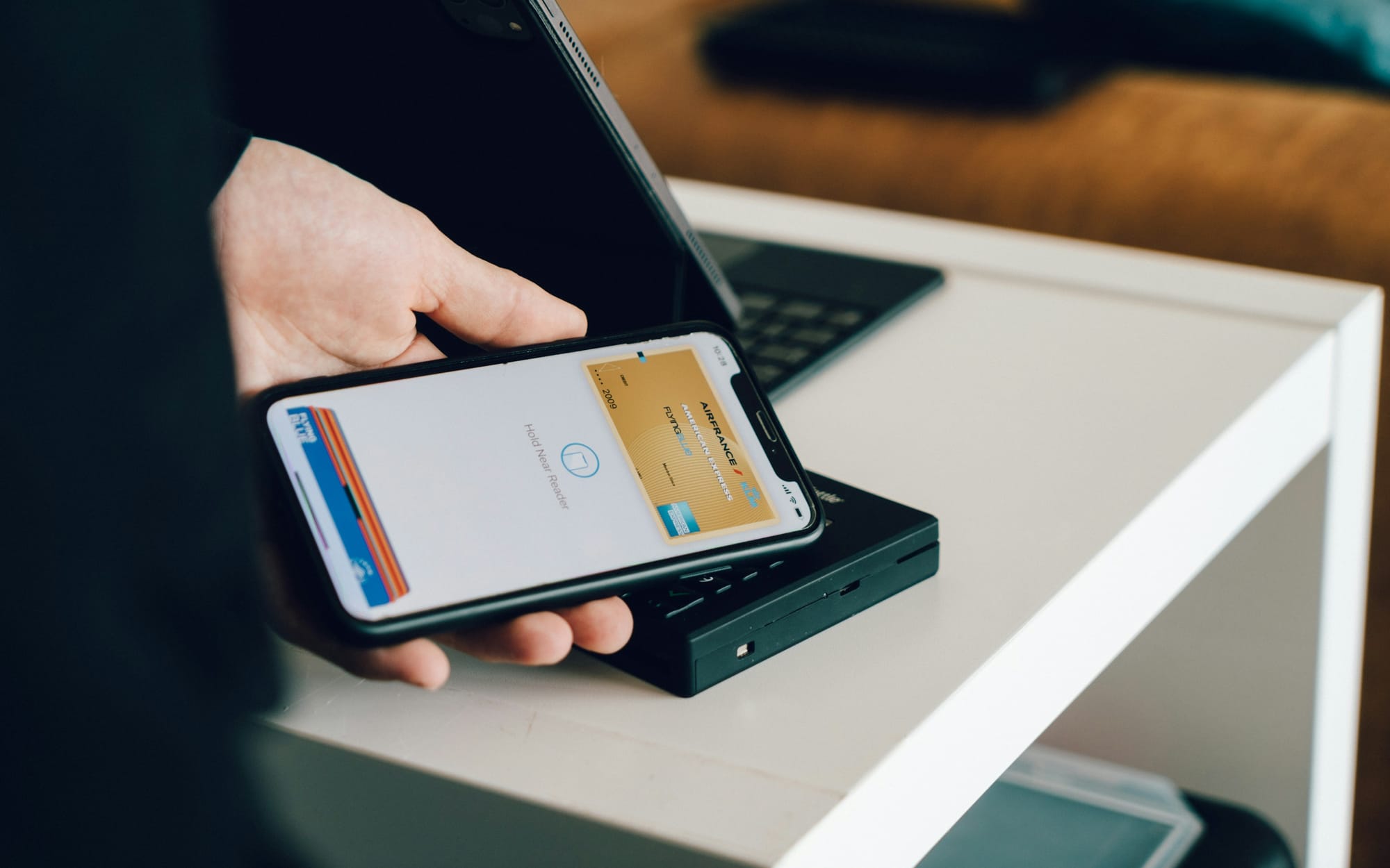 Smartphone held over a contactless payment reader