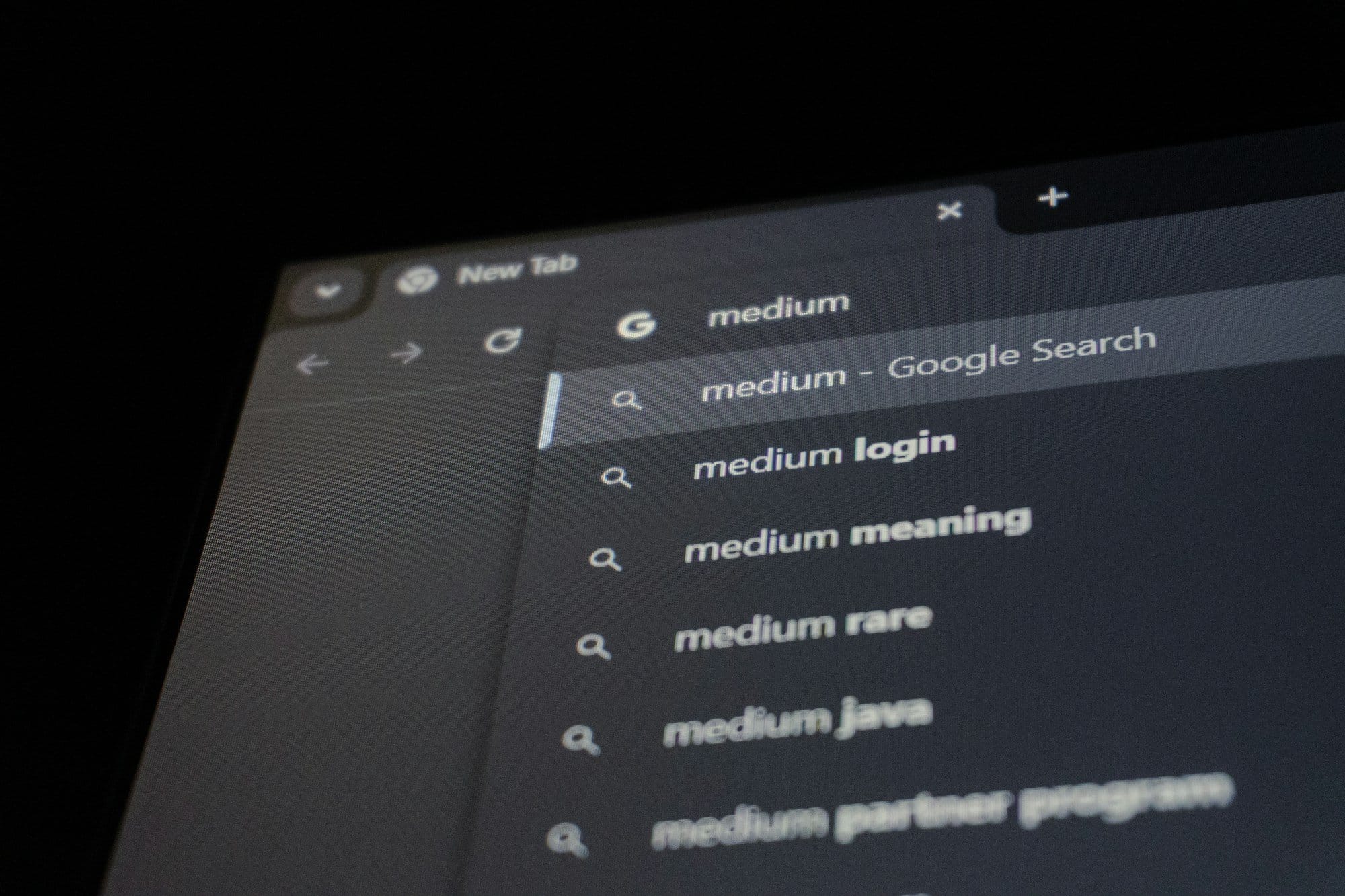 A browser search bar displaying typed suggestions