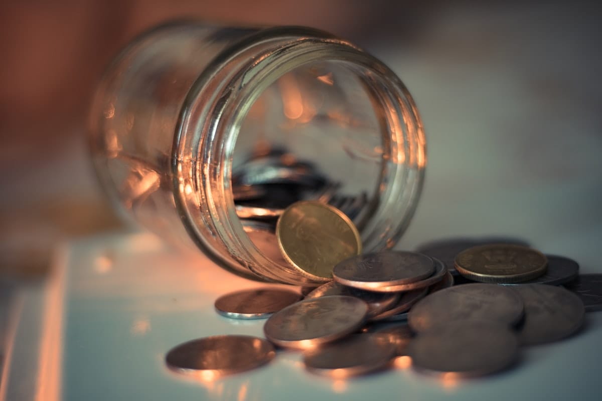 Glass tip jar on a counter for patronage tips