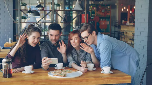 Friends on a group video call at a cafe — Photo by Vitaly Gariev (@silverkblack) / Unsplash -5FmXX1YUks